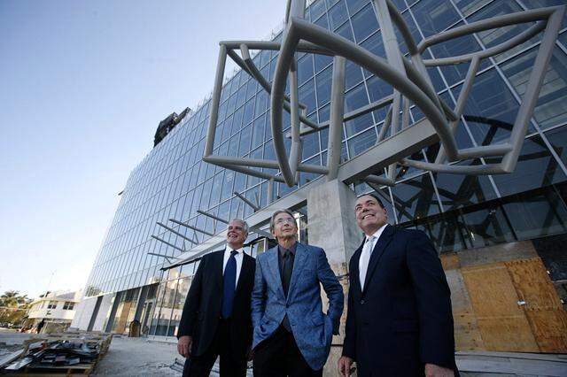 Neisen O. Kasdin, Chair of the Board of Directors for the Miami Downtown Development Authority, left, Howard Herring, President and CEO of the New World Symphony, center and Michael Tilson Thomas, Artistic Director of the New World Symphony, take a hard-hat tour of the new building in 2010. The building opened in 2011.